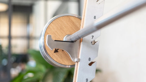 Close-up of the NOHRD WeightPlate sitting on the NOHRD SquatRack.