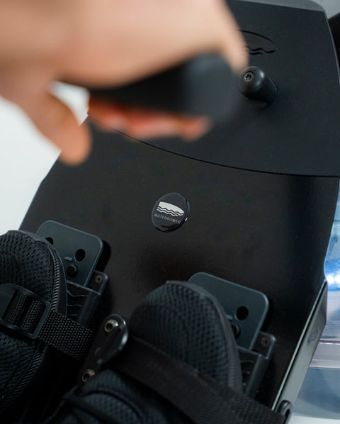 Close-up of the WaterRower Metallic footboard whilst in-use by a rower.