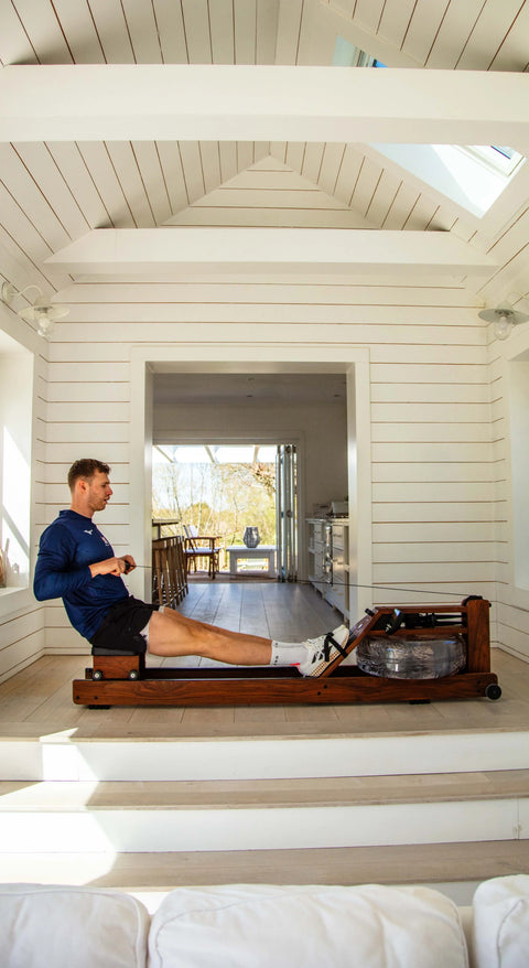 Olympic rower, Rory Gibbs, using a WaterRower Original in a waterfront home.