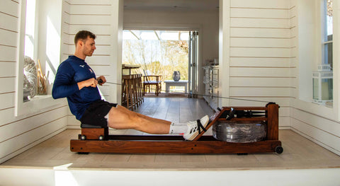 Olympic rower, Rory Gibbs, using a WaterRower Original in a waterfront home.